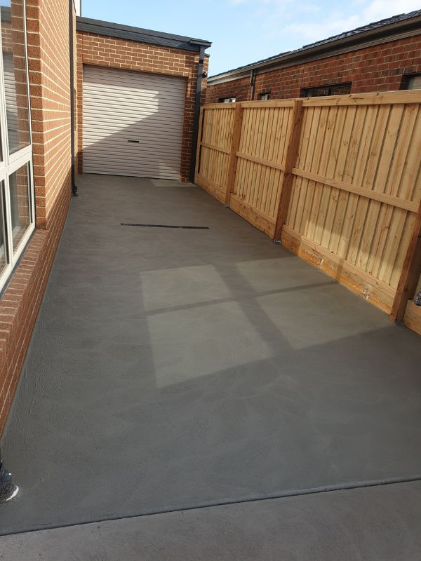 concreted area from driveway to garage